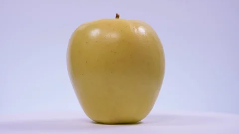 Apple Spinning on White Background. Summer, Yellow 스톡 동영상 128330040