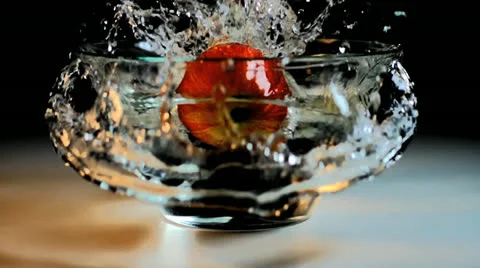 Apple splashes into water in slow motion Stock-Footage 24735644