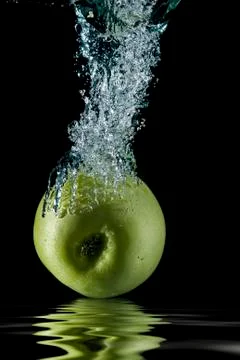 Apple splashing. Stock Photos