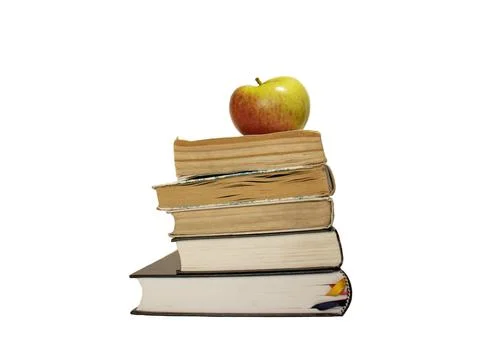 Apple on a stack of books isolated on the white background Foto stock