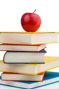 Apple on a stack of books Stock Photos