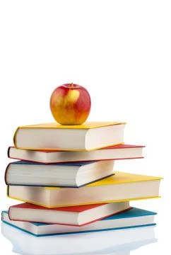 Apple on a stack of books Stock Photos