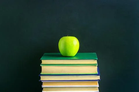 Apple on stack books Stock Photos