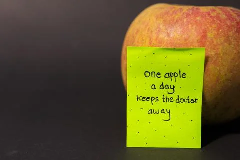 Apple with sticky notes Stock Photos
