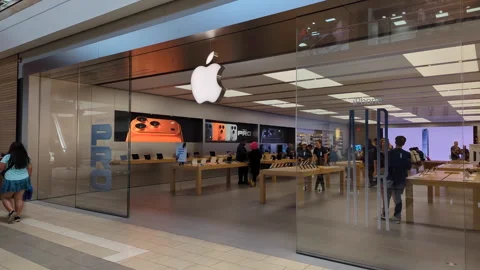 Apple Store With Customers. Customers Browsing, Trying and Buying Apple Pro.. Stock Footage 318547169