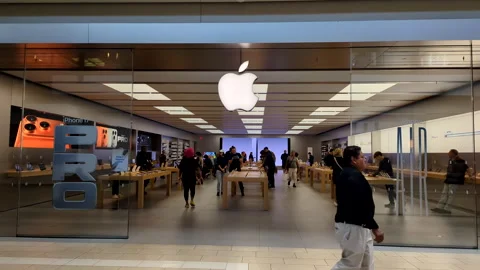 Apple Store With Customers. Customers Browsing, Trying and Buying Apple Pro.. Stock Footage 318547270