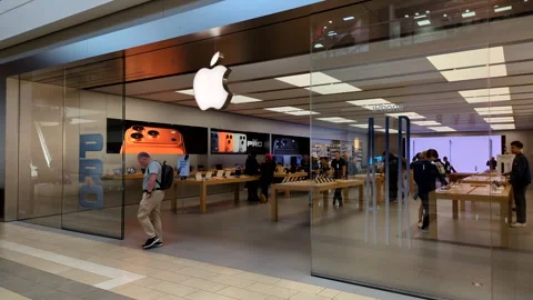 Apple Store With Customers. Customers Browsing, Trying and Buying Apple Pro.. Stock Footage 320829757