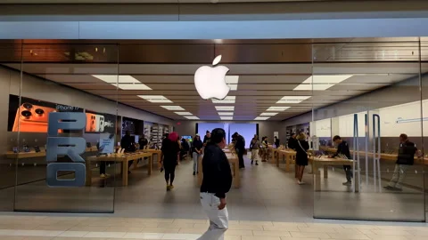 Apple Store With Customers. Customers Browsing, Trying and Buying Apple Pro.. Stock Footage 320831837
