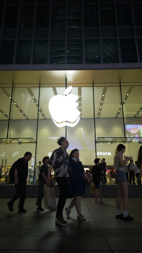 Apple Store glowing logo and pedestrians at night in SHANGHAI CHINA Stock-Footage 344922575
