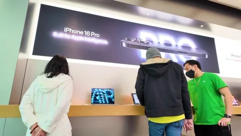 Apple store interior, computers, staff, customers, consumer electronics, iphones Stock Footage 307874764