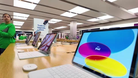 Apple store interior, computers, staff, customers, consumer electronics, iphones Stock Footage 307878922