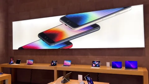 Apple Store interior with large advertising for new iPad iPhone SE MacBook Pro Stock Footage 219779184