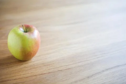 Apple on a table Stock Photos