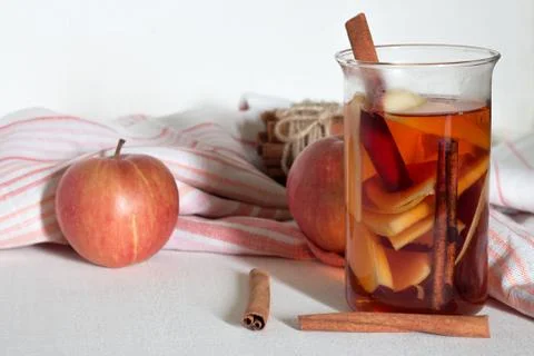 Apple tea with cinnamon on white background. Stock Photos