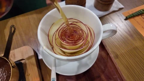Apple Tea in White Cup with Apple Slices Arranged as a Rose, Da Nang, Vietnam Stock Footage 347670399