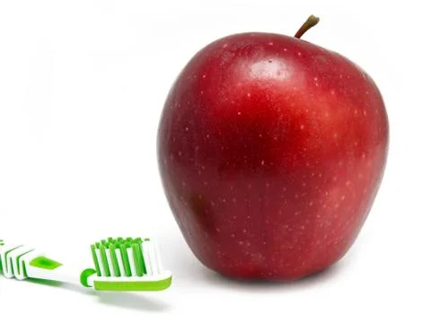 Apple, thothbrush on white Stock Photos