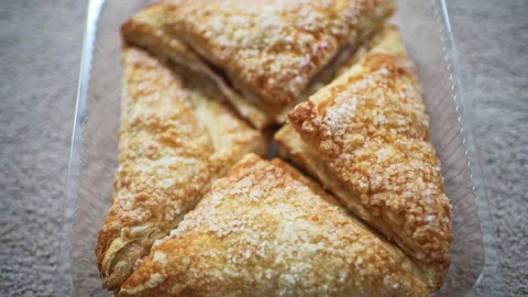 Apple turnover puff pastry pie sugar crust of sweet dessert homemade food Stock Footage 336750239