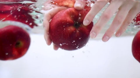 Apple washing in slow motion Stock Footage 76040994