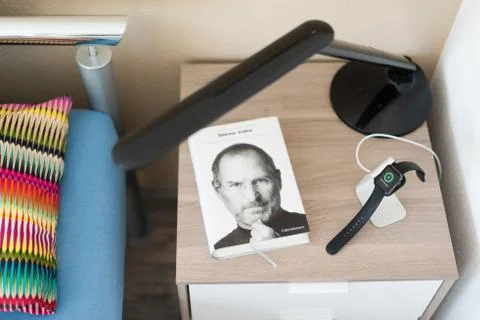 Apple Watch being charged on the bedside table Stock Photos