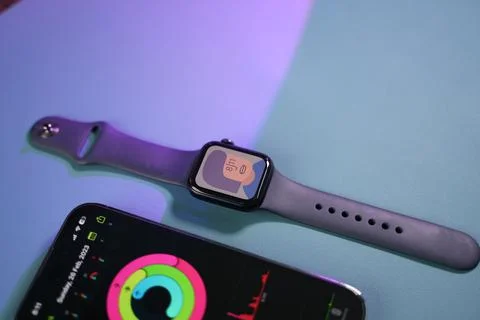 An apple Watch beside an iPhone Stock Photos