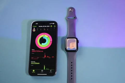 An apple Watch beside an iPhone Stock Photos