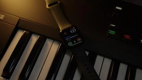 An apple Watch on top of a keyboard Stock Photos