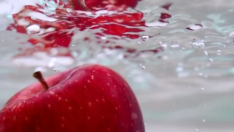 Apple in water in slow motion Stock Footage 76041036