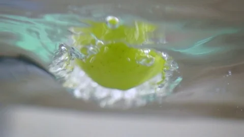 Apple in water in slow motion Stock Footage 76041131