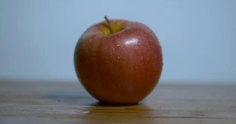 Apple on Wooden Table Stock Photos