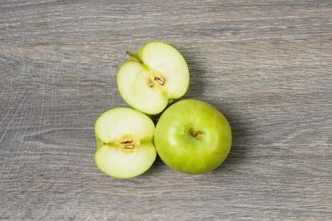 Apple on wooden table Stock Photos