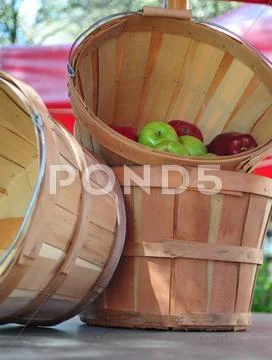 Apples and bushel baskets Stock Photos