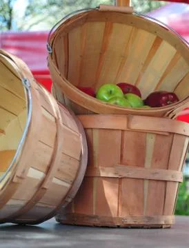 Apples and bushel baskets Stock Photos