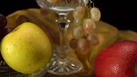 Apples and grapes on a black background. 動画素材 148271922