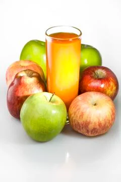 Apples and juice in glass Stock Photos
