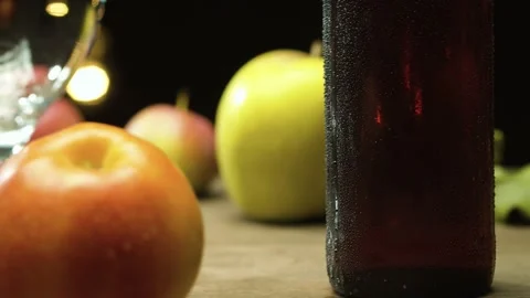 Apples and a misted bottle of cider Stock Footage 142737019