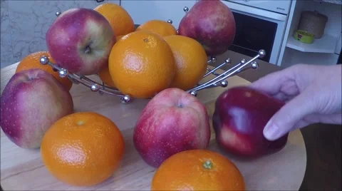 Apples and tangerines on table Stock Footage 46991406