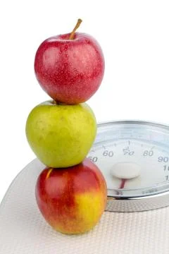 Apples on a balance Stock Photos