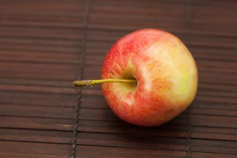 Apples on a bamboo mat Stock Photos