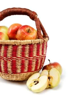 Apples in a basket on a white background. Stock Photos