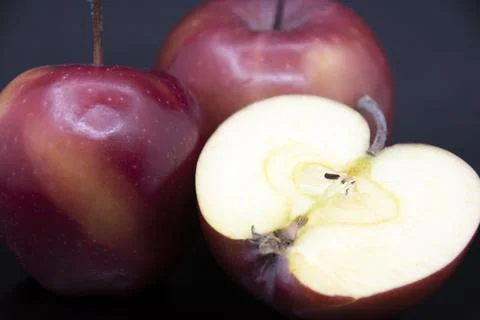 Apples on a black background Stock Photos