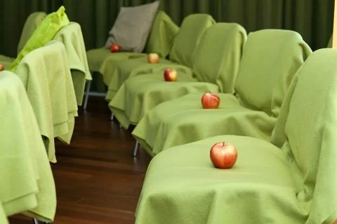 Apples on the chairs Stock Photos