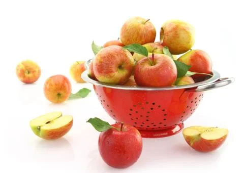 Apples in colander, isolated on white 스톡 사진