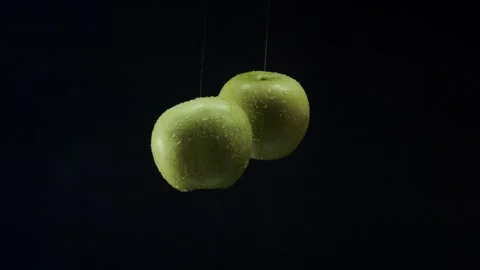 Apples collide with each other, shooting video from hands 動画素材 327572571