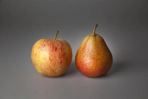 Apples compared with pears Stock Photos
