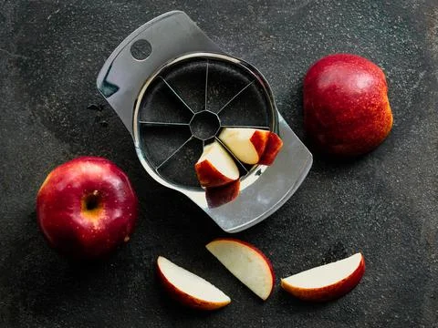 Apples with a cutter. Stock Photos