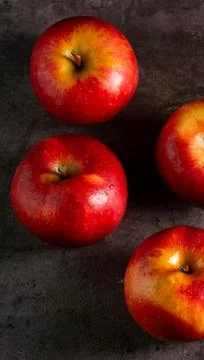 Apples in a dramatic low key concept with a dark background in variety angles Stock Photos