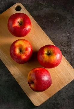 Apples in a dramatic low key concept with a dark background in variety angles Stock Photos