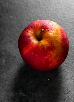 Apples in a dramatic low key concept with a dark background in variety angles Stock Photos