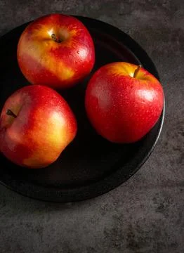 Apples in a dramatic low key concept with a dark background in variety angles Stock Photos