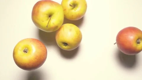 Apples fall on the table super slow mo 960fps Stock Footage 72304126